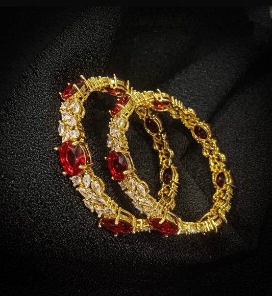 Red Stones, Sparkling White Diamonds, and Opulent Gold