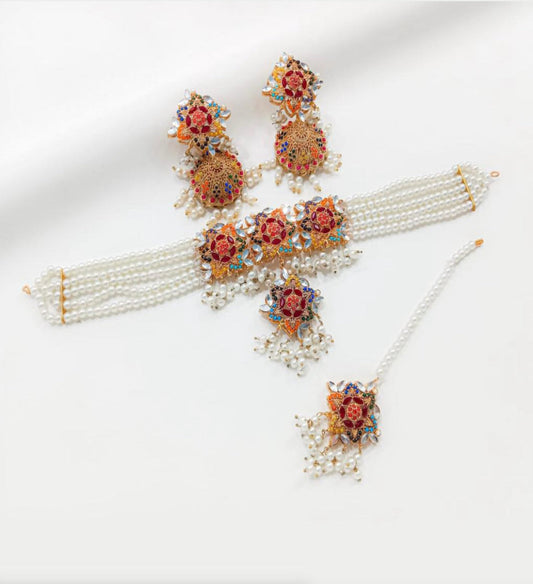 Ornate jewelry Set With Floral Designs And Pearl Strands