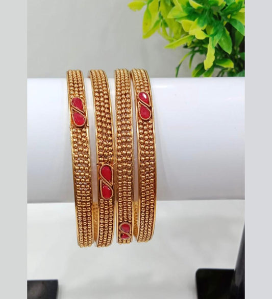 Golden Traditional Bangles with Red Stone Detailing – Set of 4