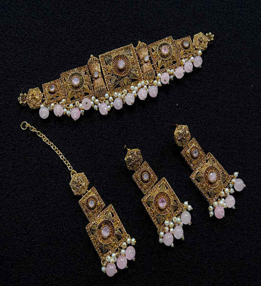 Ornate Gold Jewelry Set With Pink Stones